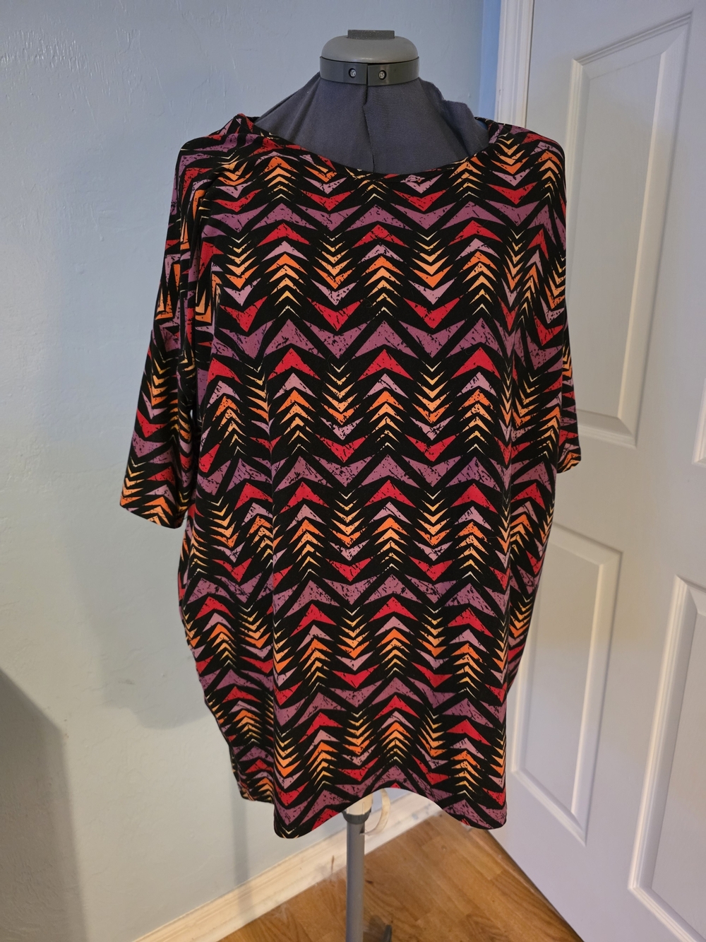 LuLaRoe Irm Black Top with Pink and Orange Chevron Print